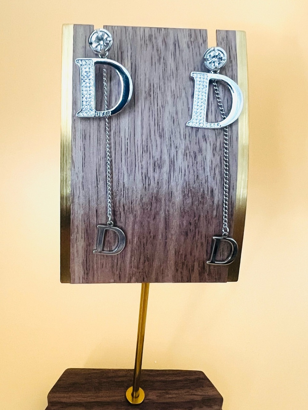 Stainless steel dangling earrings with large clear CZ